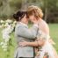 two brides hug one another during their wedding photos